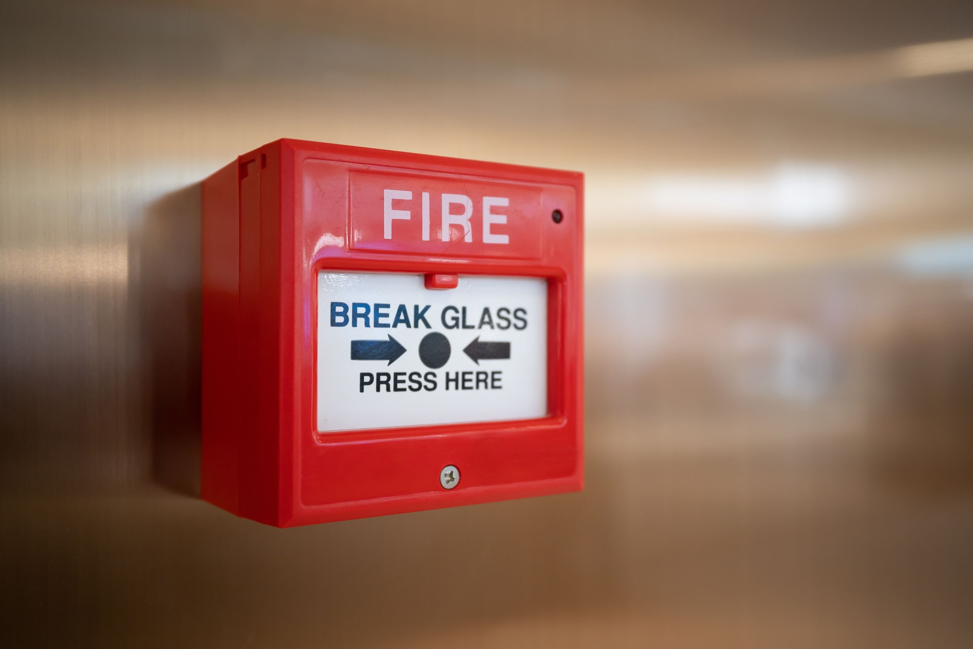 Fire alarm switch on the wall in shopping mall.